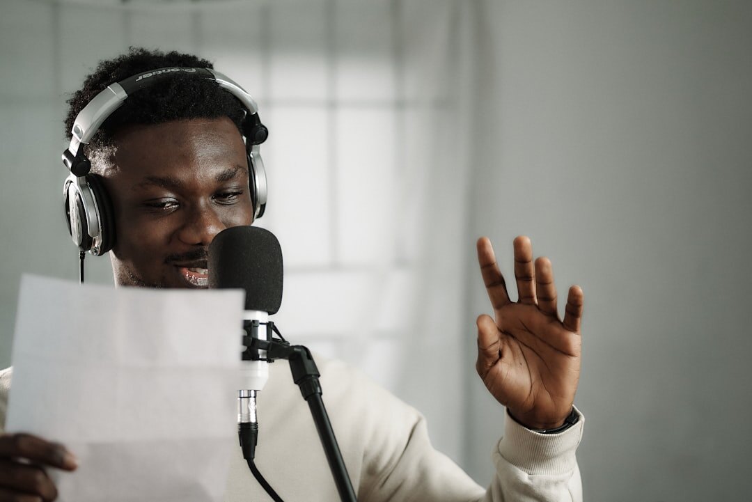 Journalist preparing interview questions with notes and recording equipment