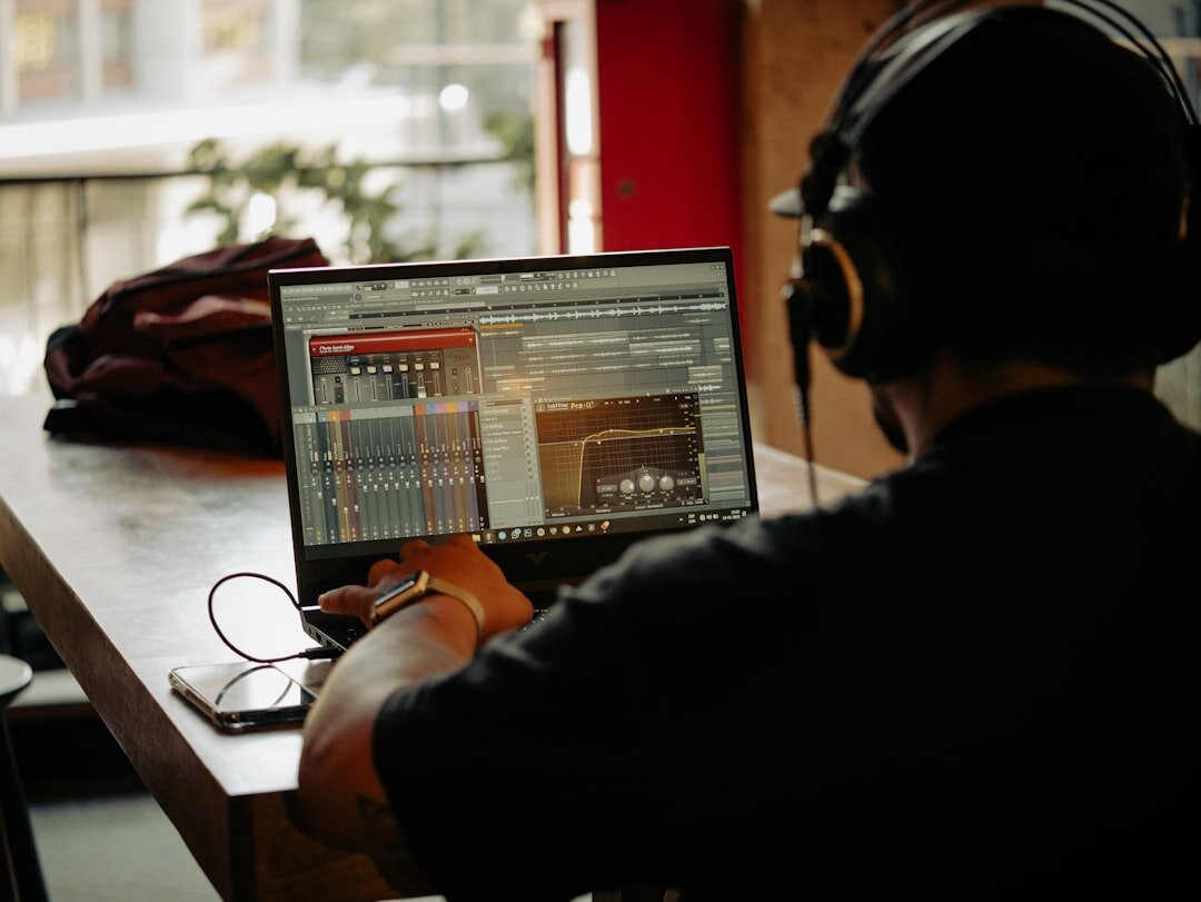 Journalist investigating a story using multiple sources at a workstation